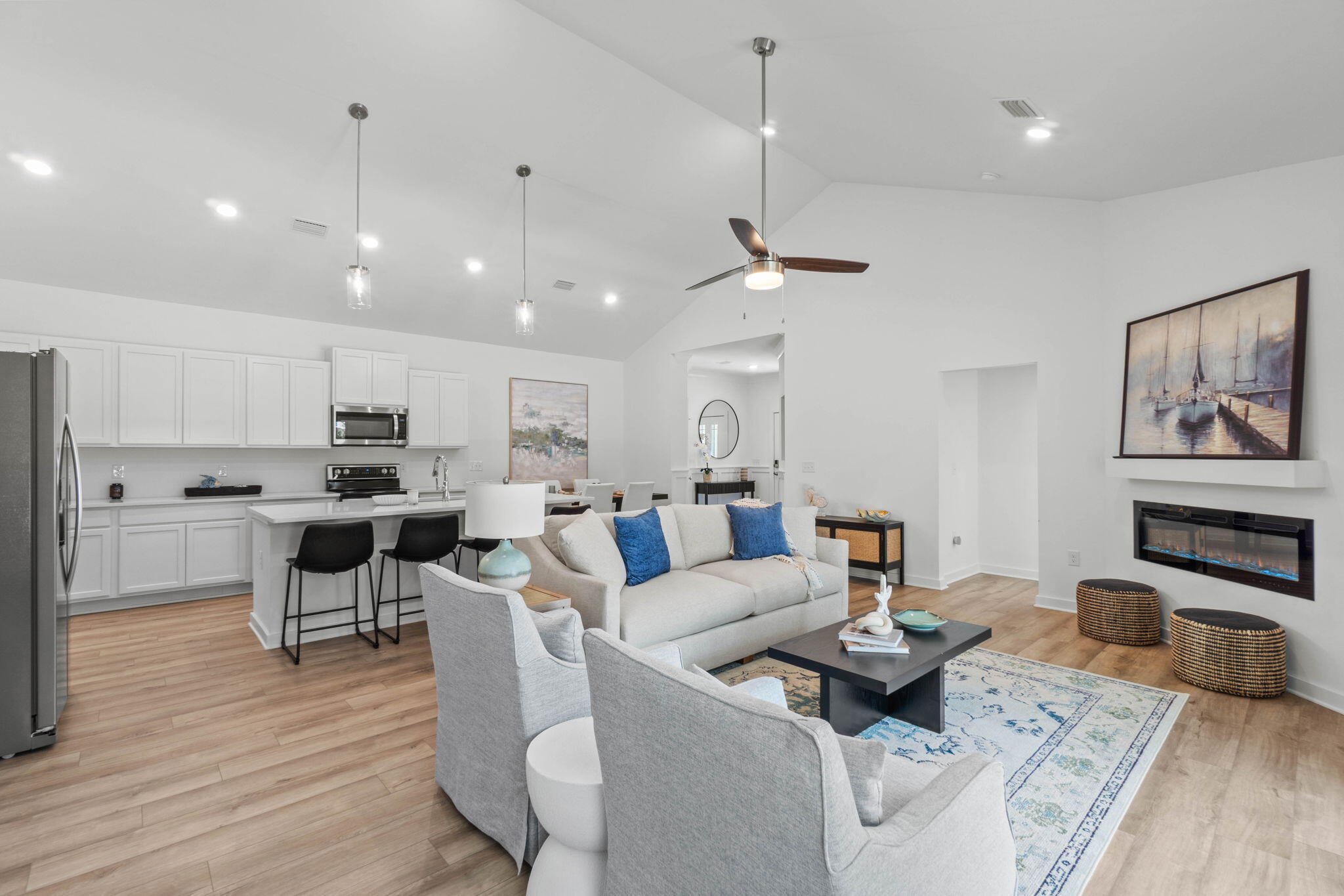 165 Sweetclover Street Freeport, FL 32439 - Photo 6 of 34 a living room with furniture kitchen view and a wooden floor