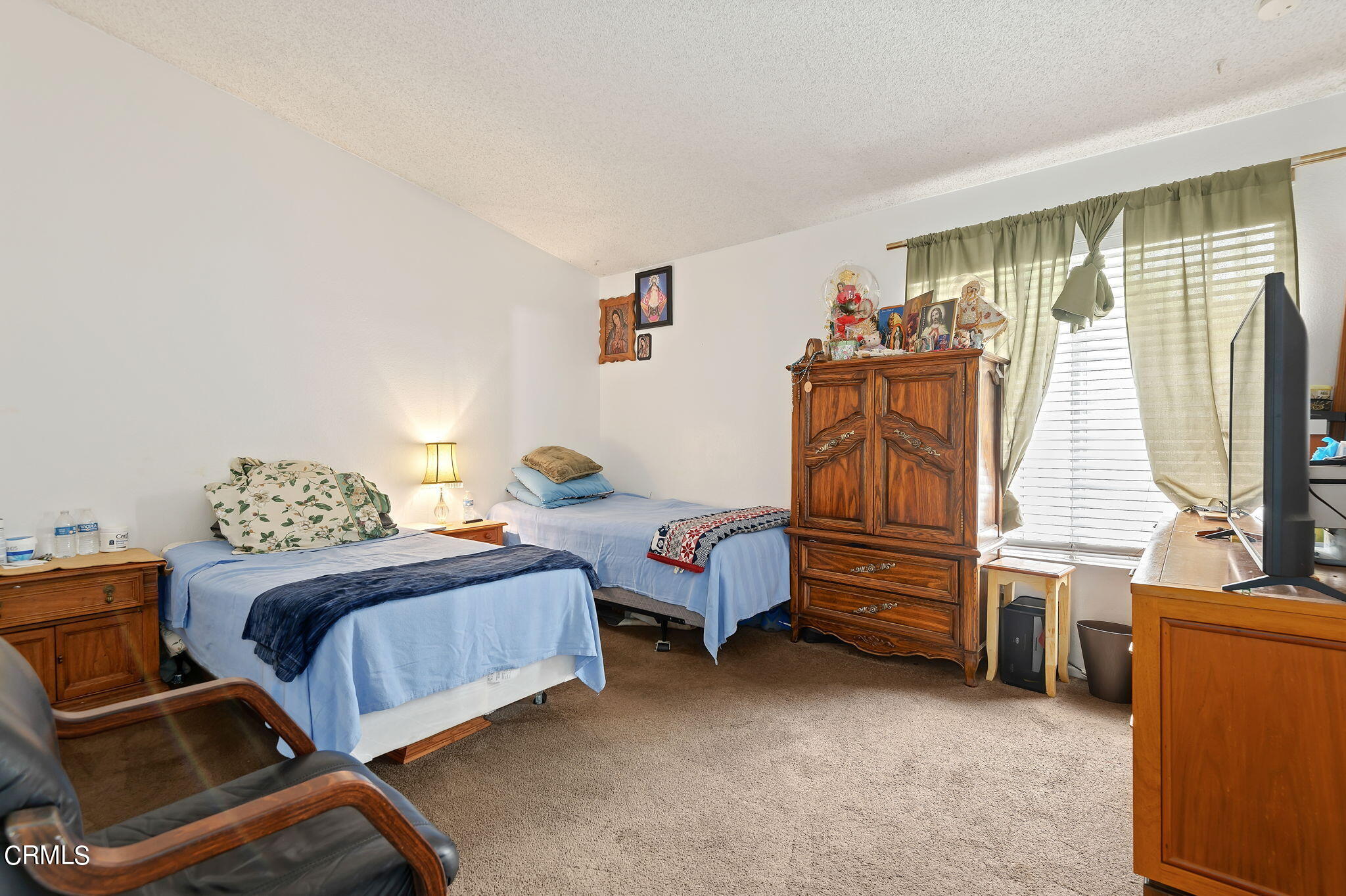 5124 Jefferson Square Oxnard, CA 93033 - Photo 11 of 12 a bedroom with furniture and a window