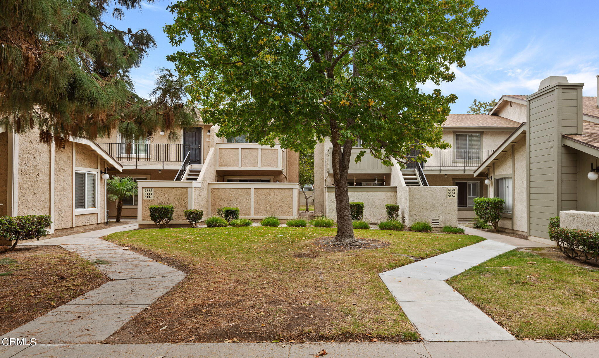5124 Jefferson Square Oxnard, CA 93033 - Photo 2 of 12 front view of a house with a yard