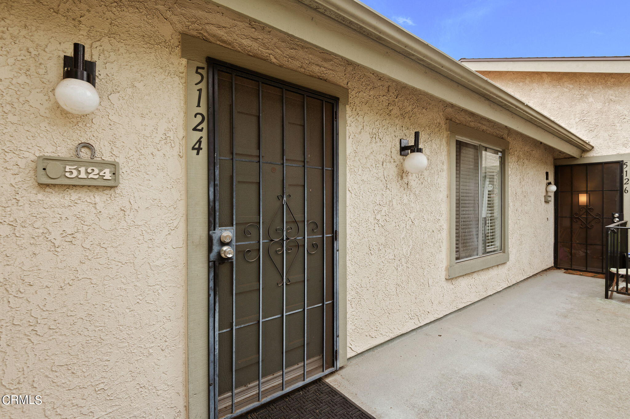 5124 Jefferson Square Oxnard, CA 93033 - Photo 3 of 12 a view of a hallway with wooden floor and staircase