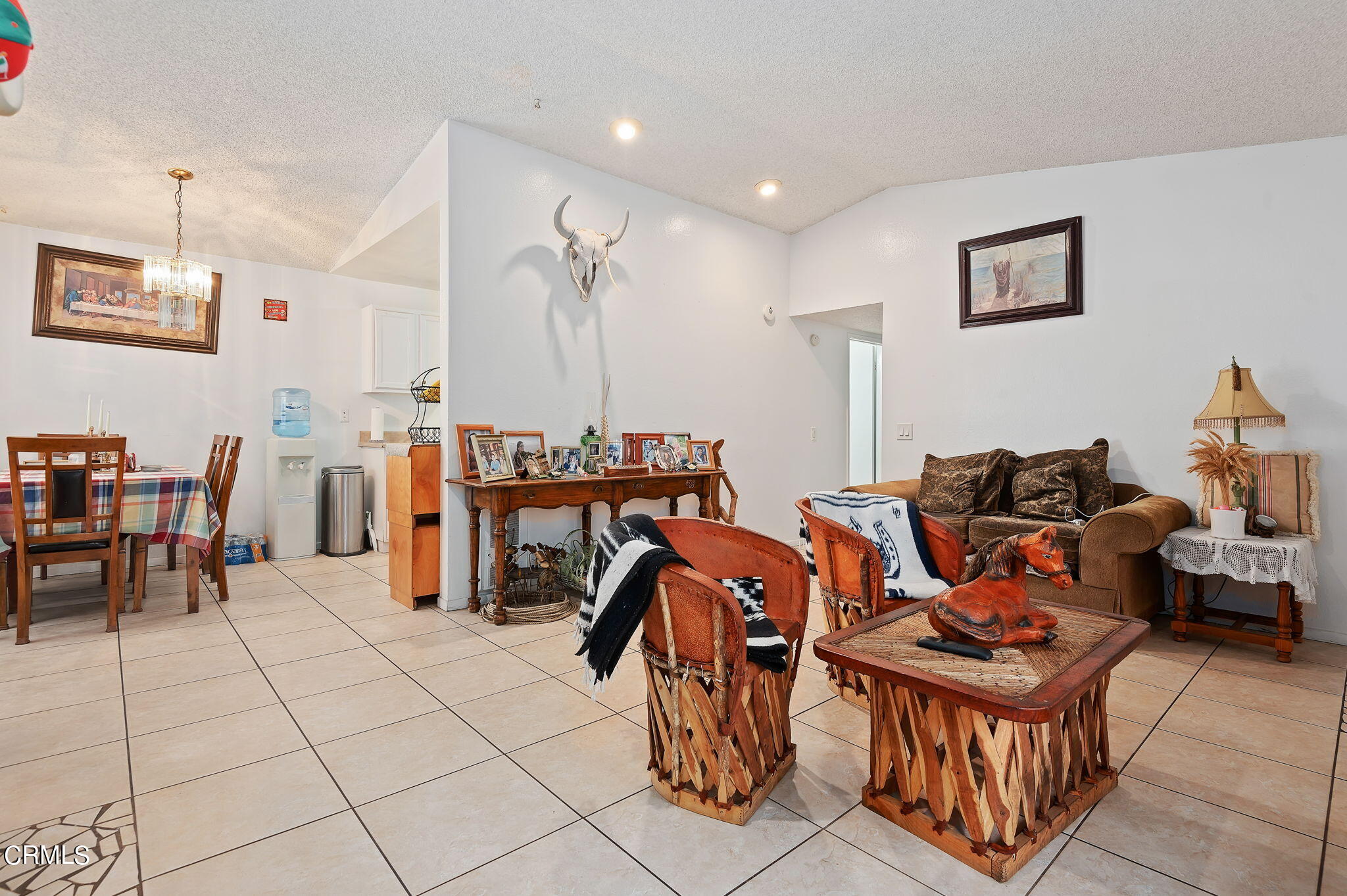 5124 Jefferson Square Oxnard, CA 93033 - Photo 7 of 12 a living room with furniture a flat screen tv and a table