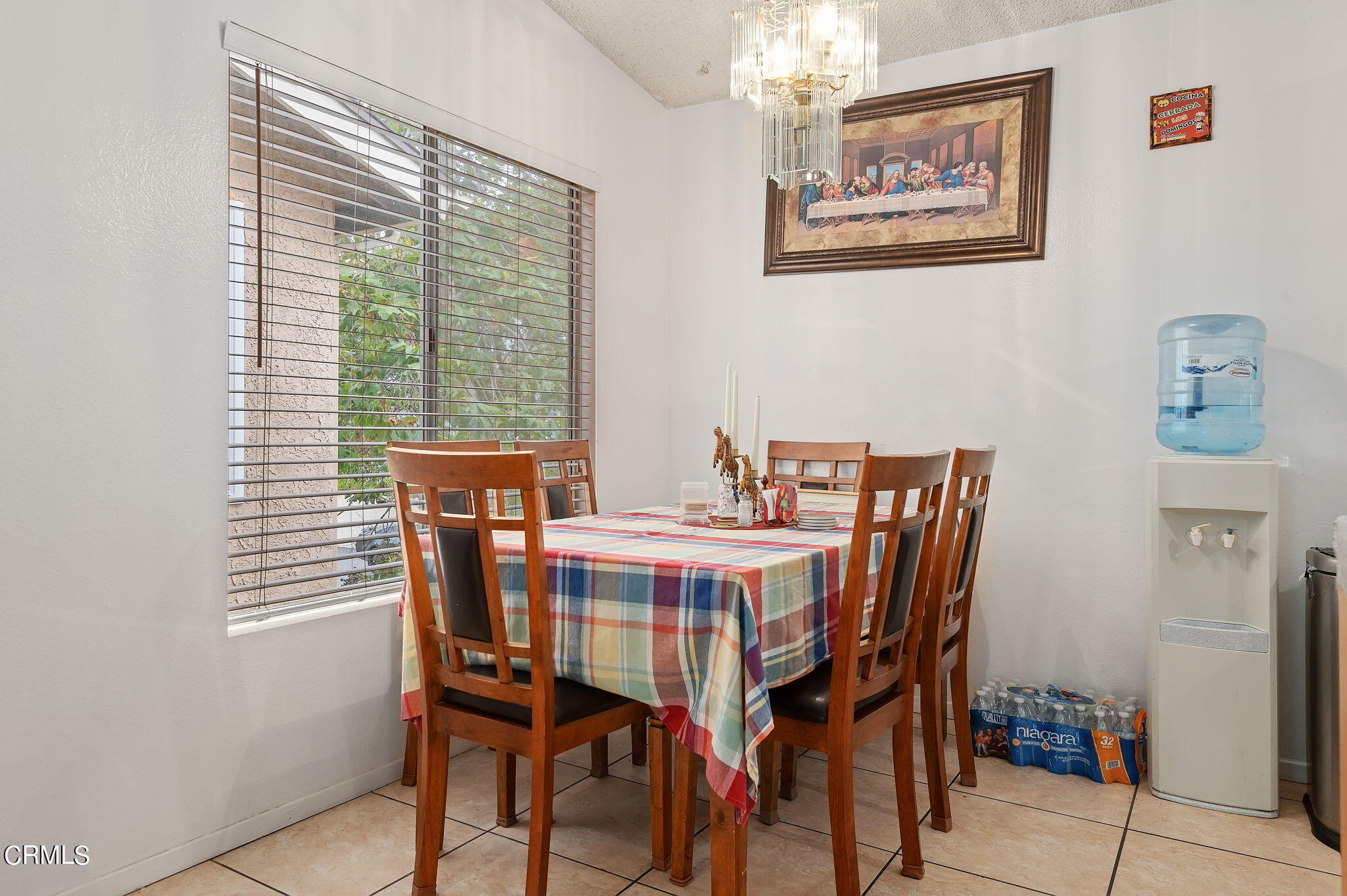 5124 Jefferson Square Oxnard, CA 93033 - Photo 8 of 12 a view of a dining room with furniture and chandelier