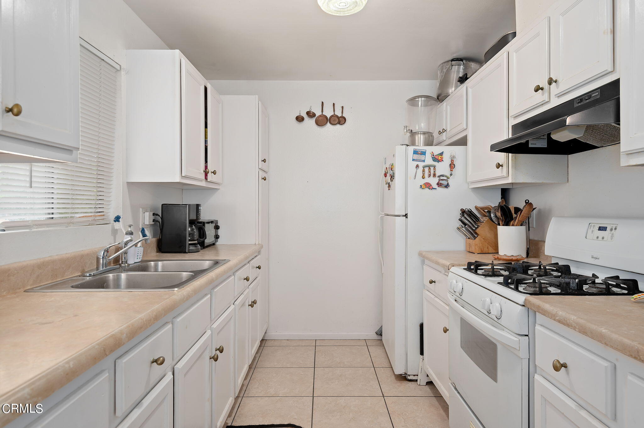 5124 Jefferson Square Oxnard, CA 93033 - Photo 9 of 12 a kitchen with stainless steel appliances granite countertop a sink stove and cabinets
