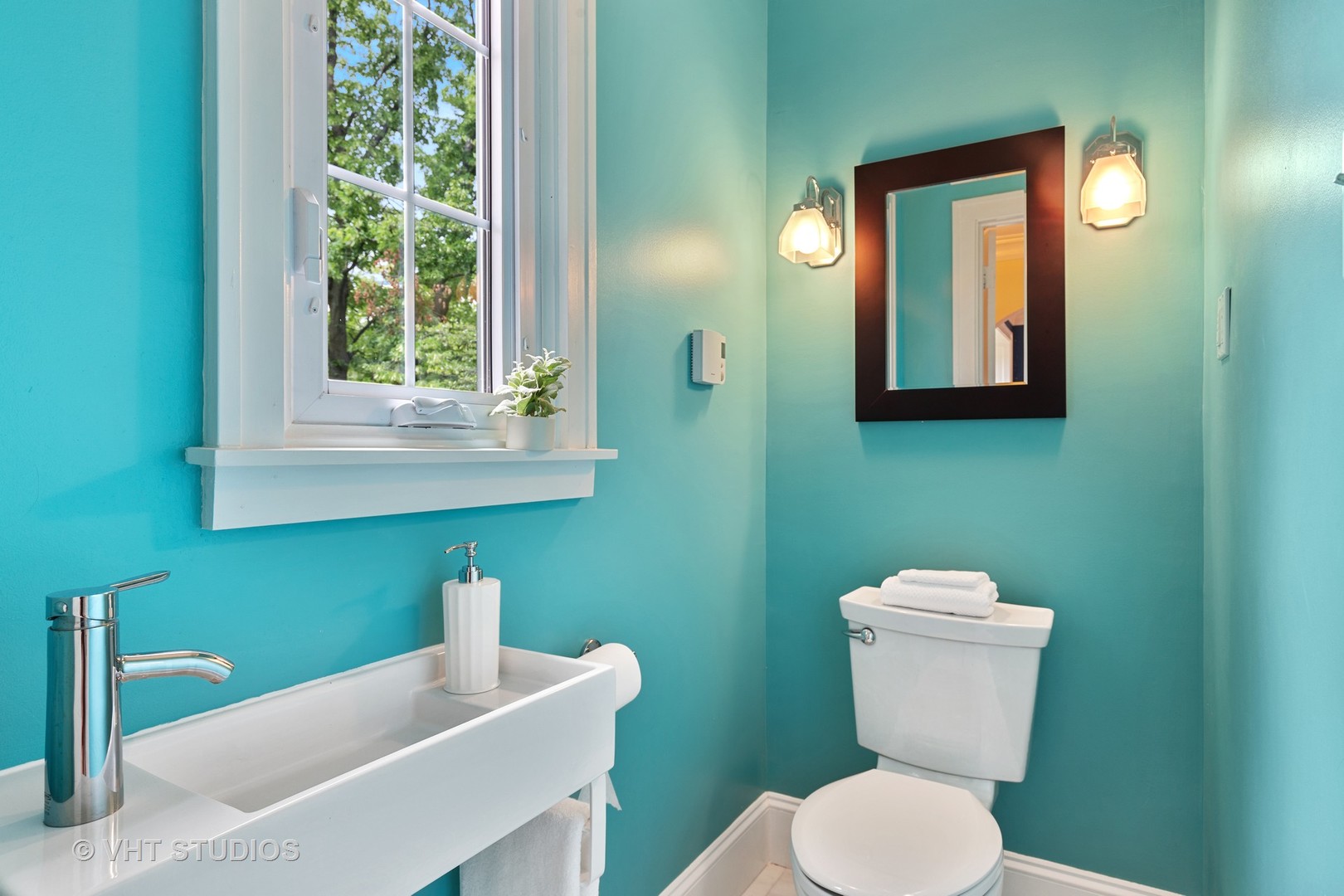 255 Addison Road Riverside, IL 60546 - Photo 16 of 24 a bathroom with a toilet sink and mirror