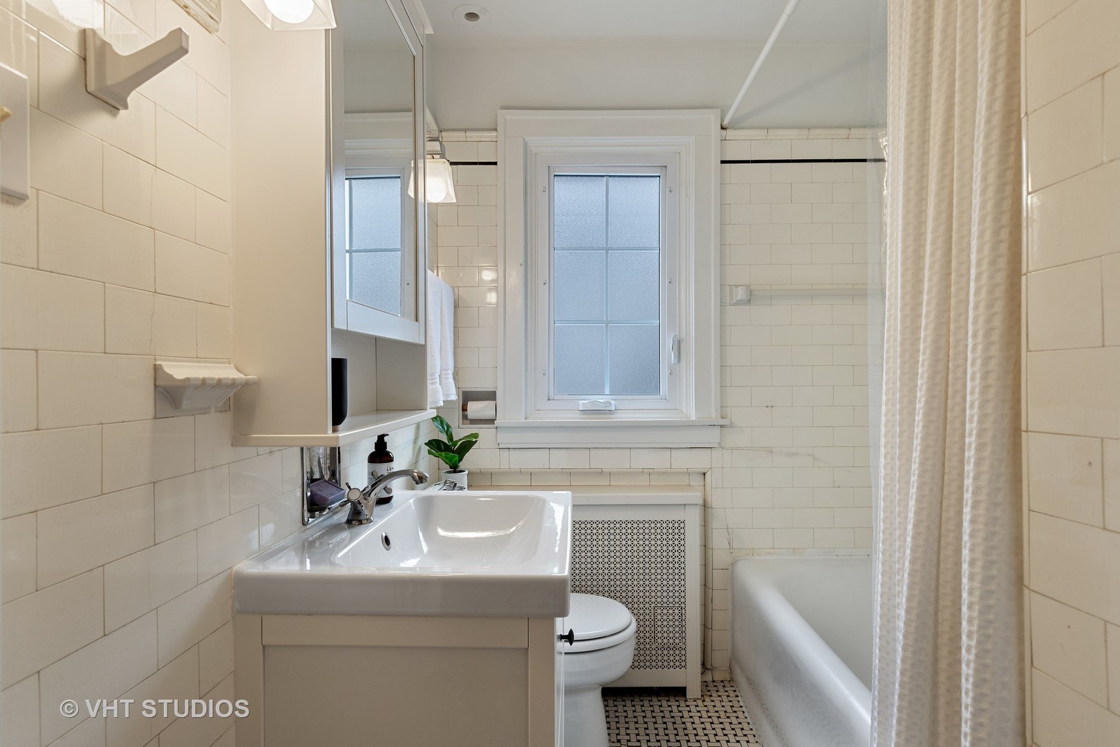 255 Addison Road Riverside, IL 60546 - Photo 17 of 24 a bathroom with a sink toilet and shower