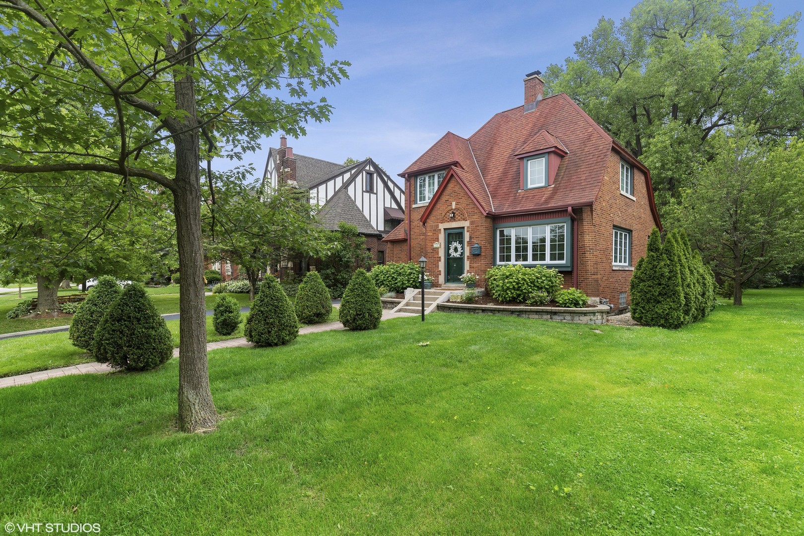 255 Addison Road Riverside, IL 60546 - Photo 3 of 24 a front view of a house with a yard