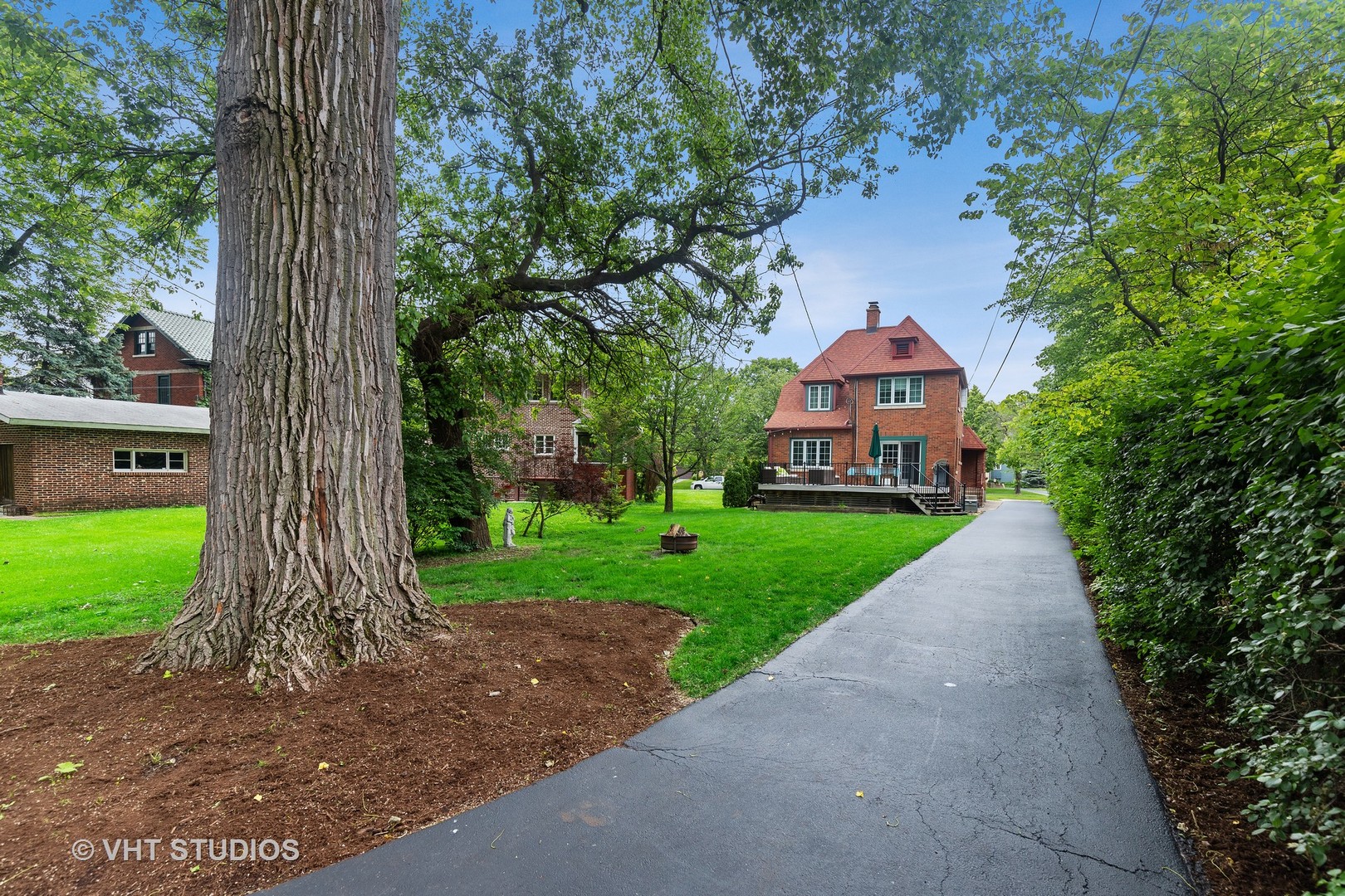 255 Addison Road Riverside, IL 60546 - Photo 24 of 24 a front view of a house with a yard and an trees