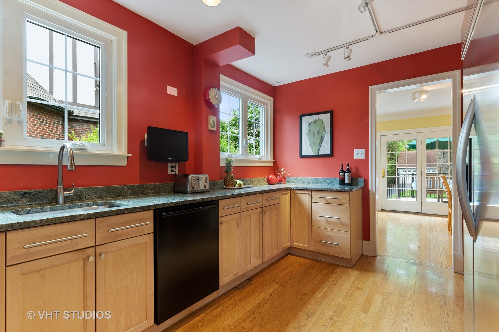 255 Addison Road Riverside, IL 60546 - Photo 7 of 24 a kitchen with granite countertop a stove a sink and a window
