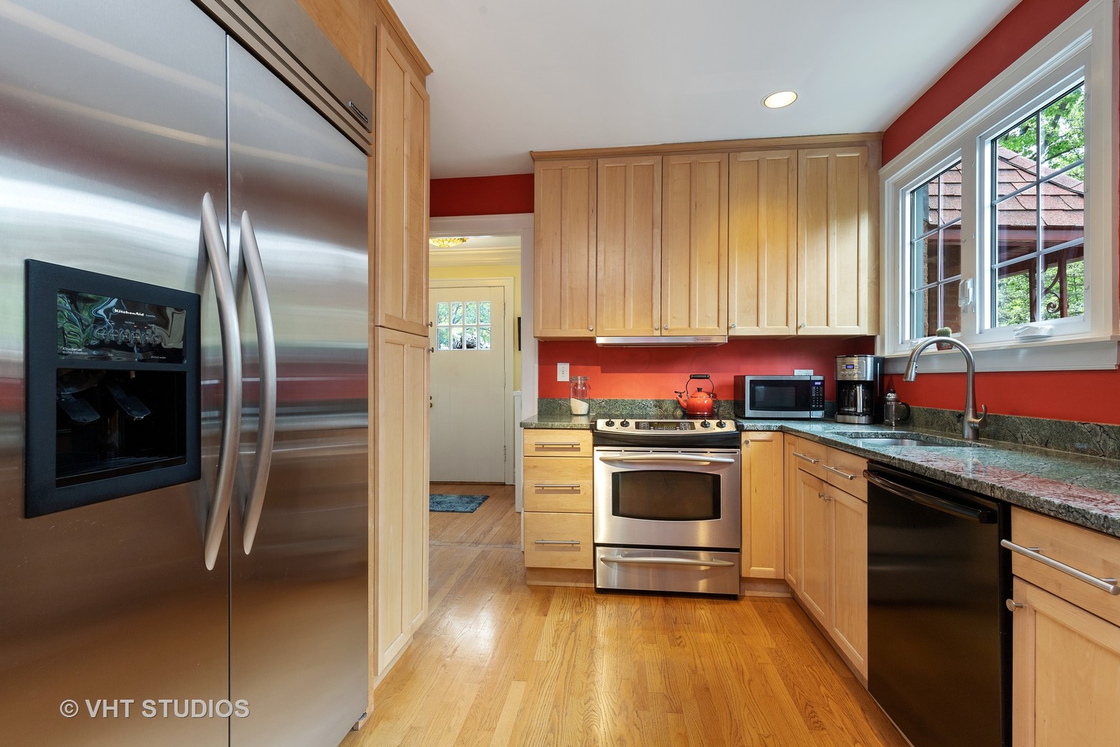 255 Addison Road Riverside, IL 60546 - Photo 8 of 24 a kitchen with stainless steel appliances granite countertop a stove a sink and a refrigerator