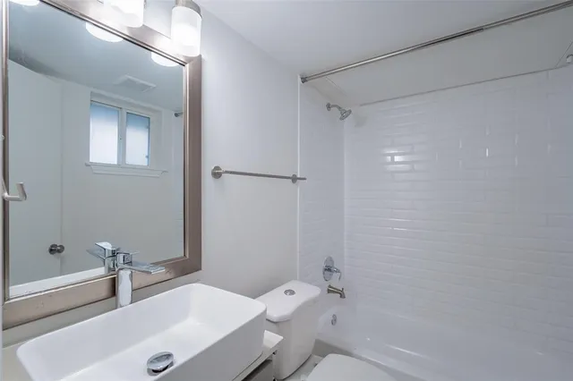 a bathroom with a toilet and a sink