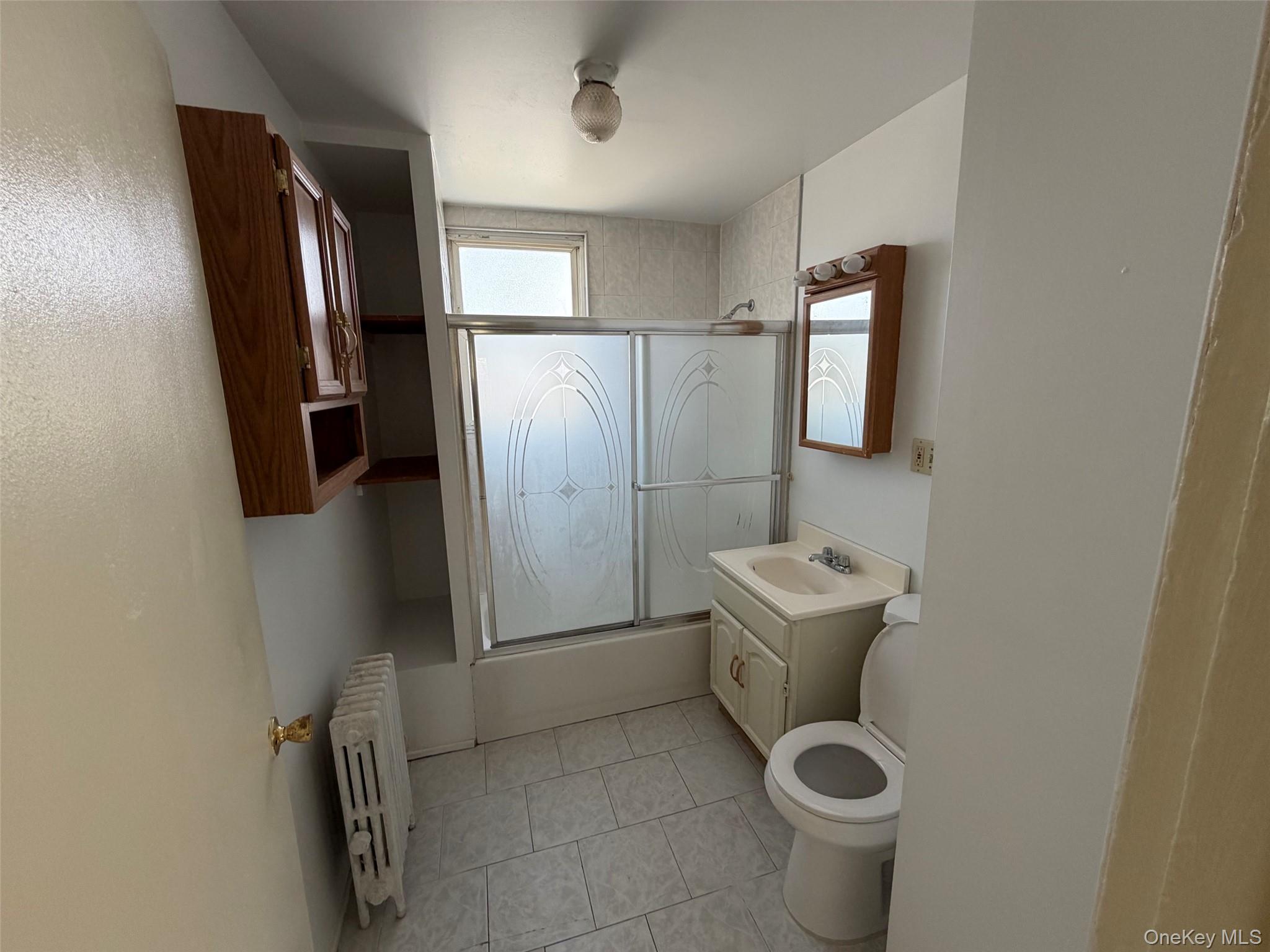 2941 Middletown Road Bronx, NY 10461 - Photo 14 of 31 a bathroom with a toilet sink and mirror