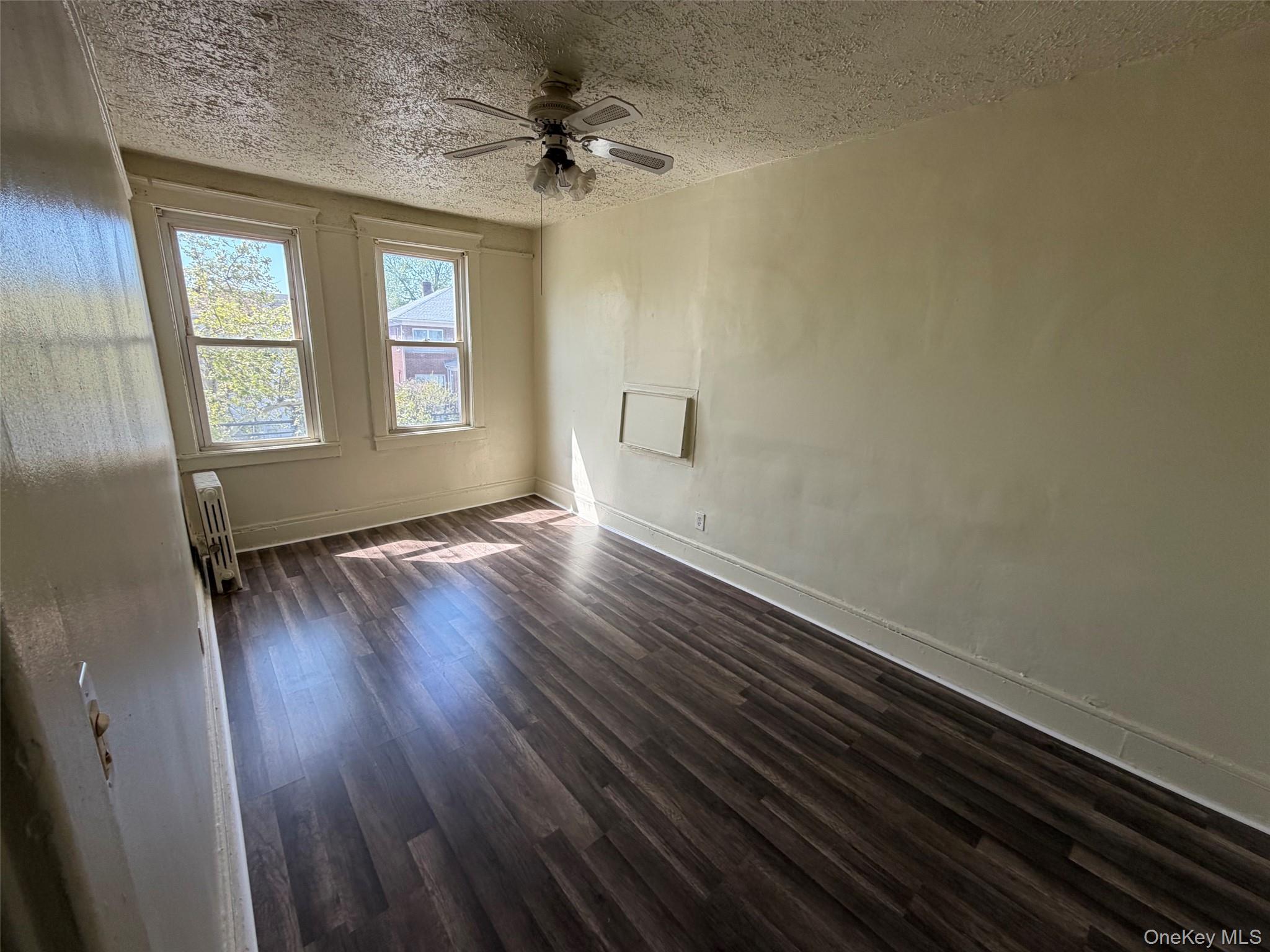 2941 Middletown Road Bronx, NY 10461 - Photo 17 of 31 wooden floor in an empty room with a window