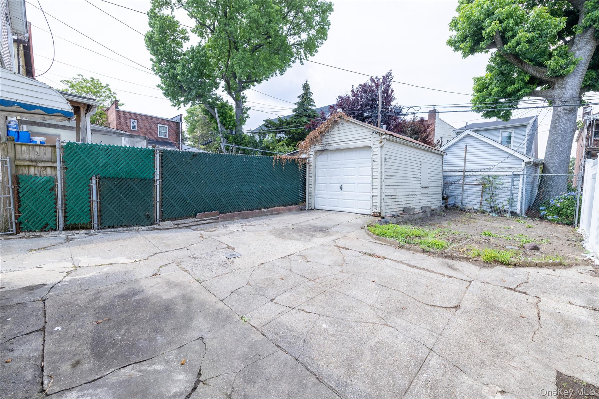 2941 Middletown Road Bronx, NY 10461 - Photo 30 of 31 a view of a house with a small yard and large trees