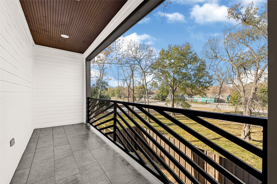 6605 Apollo Street Houston, TX 77091 - Photo 22 of 32 a view of balcony with wooden floor