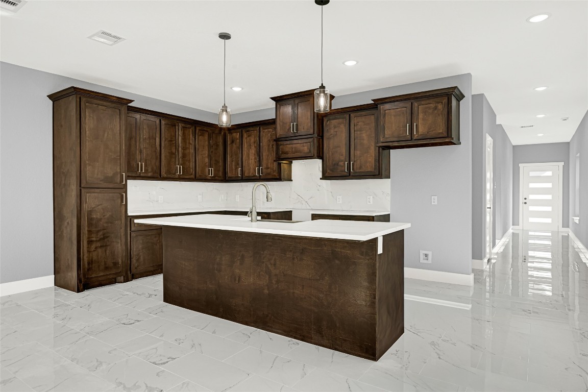 6605 Apollo Street Houston, TX 77091 - Photo 9 of 32 a kitchen with stainless steel appliances granite countertop a sink a stove and a refrigerator