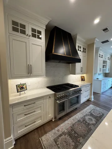 a kitchen with a stove and a sink