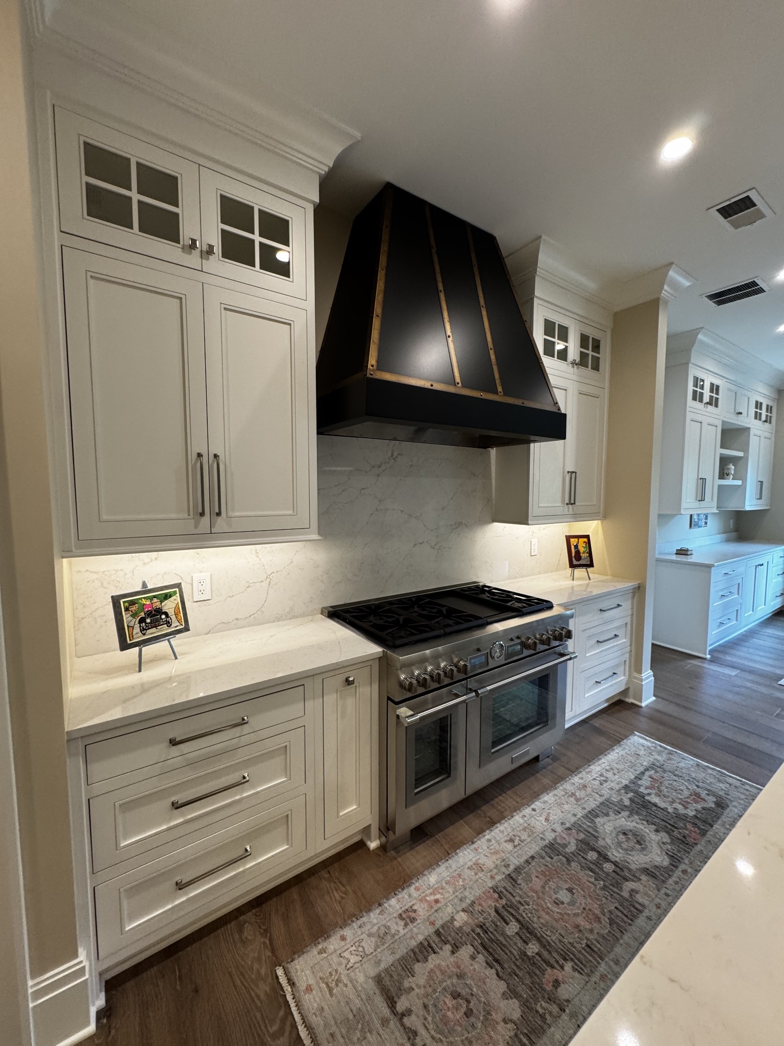 725 West Main Street, Unit 101 Franklin, TN 37064 - Photo 2 of 8 a kitchen with a stove and a sink