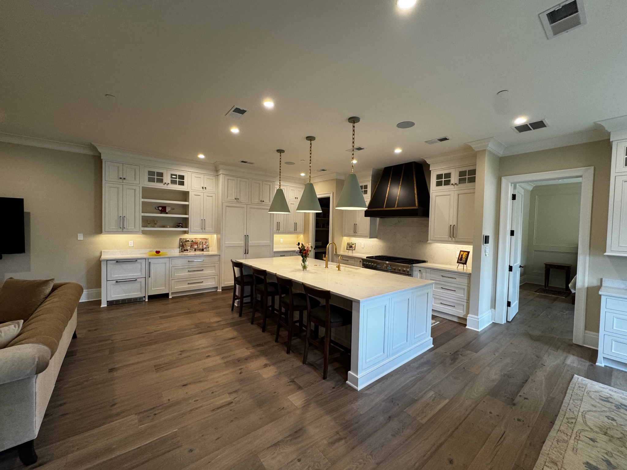 725 West Main Street, Unit 101 Franklin, TN 37064 - Photo 5 of 8 a large kitchen with stainless steel appliances granite countertop a lot of cabinets and wooden floor