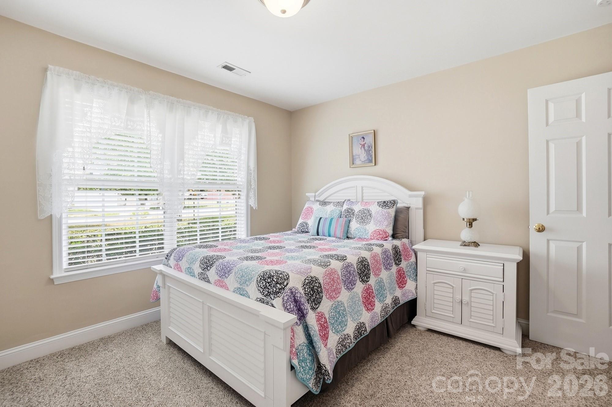 3324 Muddy Creek Road Midland, NC 28107 - Photo 36 of 46 a bedroom with a bed and a window
