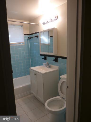 1200 South Arlington Ridge Road, Unit 315 Arlington, VA 22202 - Photo 12 of 12 a bathroom with a sink a toilet and shower
