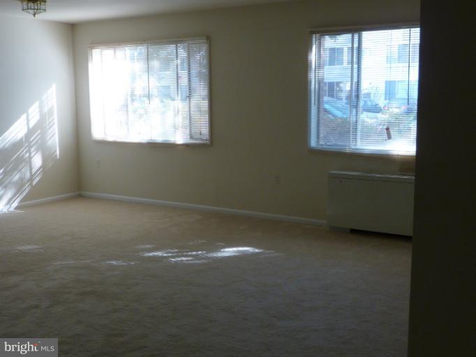 1200 South Arlington Ridge Road, Unit 315 Arlington, VA 22202 - Photo 4 of 12 a view of an empty room with a window