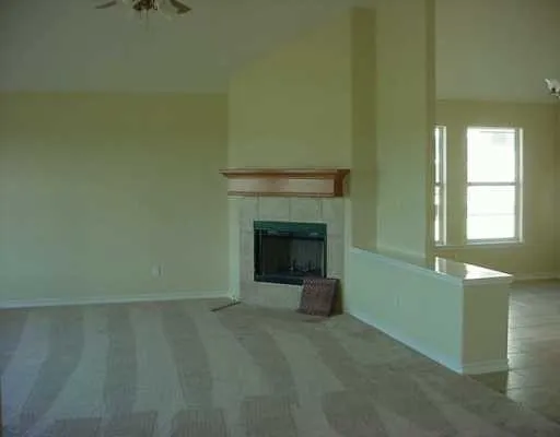 a view of a livingroom with a fireplace