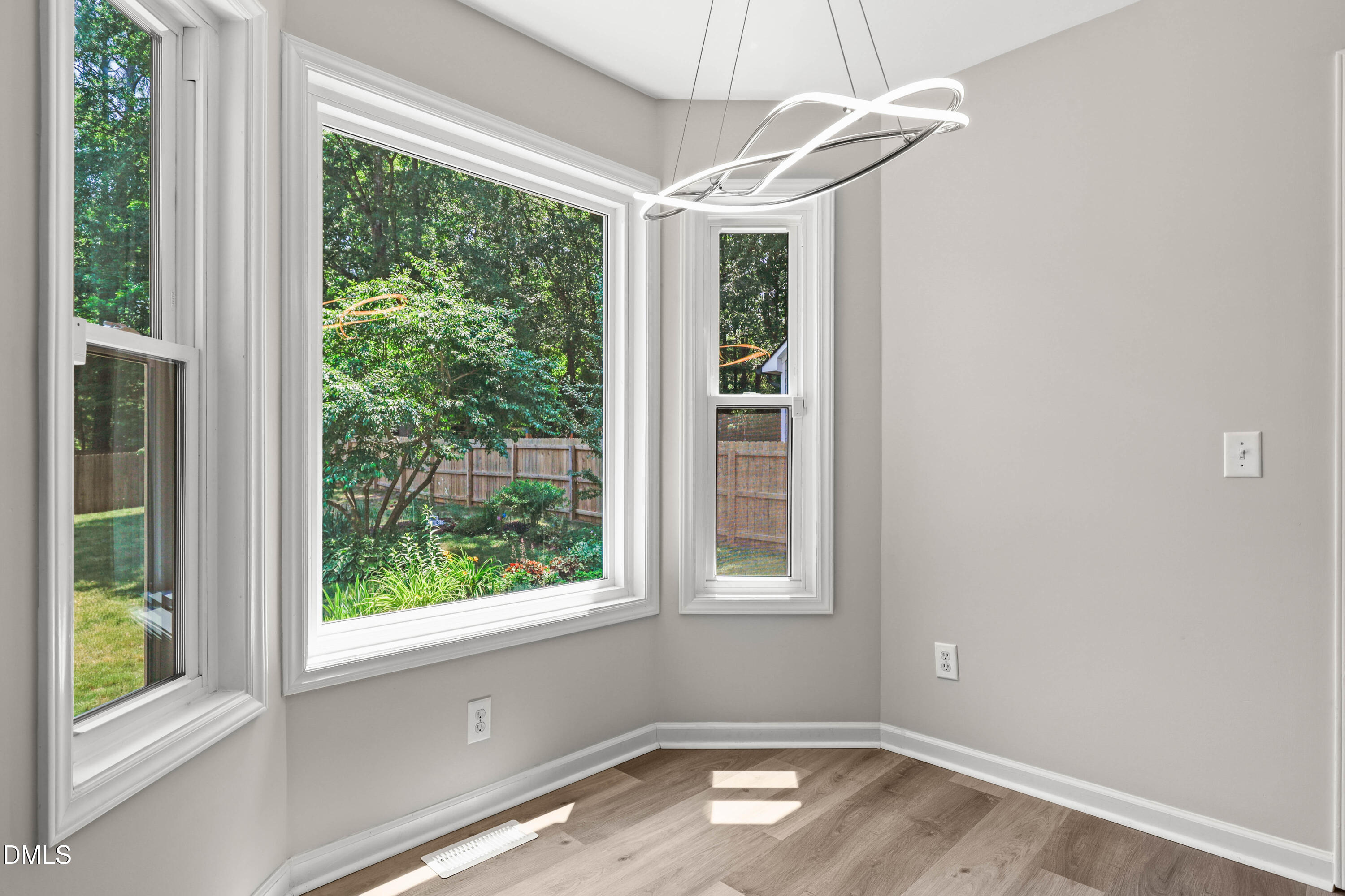 3015 Rennit Court Raleigh, NC 27603 - Photo 15 of 40 a view of room with window and hardwood floor