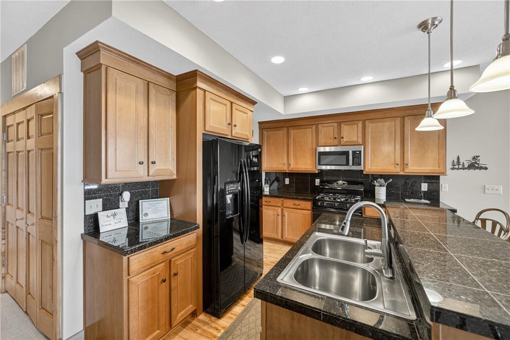 116 Lakeside Trail Champion, PA 15622 - Photo 19 of 44 a kitchen with a refrigerator a sink a stove and cabinets