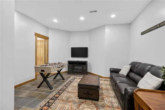 a bed room with a bed and a television