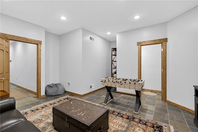 a white toilet sitting next to a shower curtain