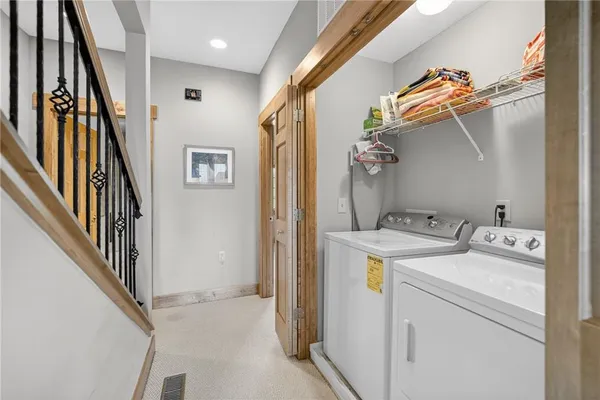 a bedroom with two beds and a couch