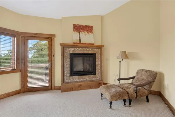 a bedroom with a bed and a fireplace