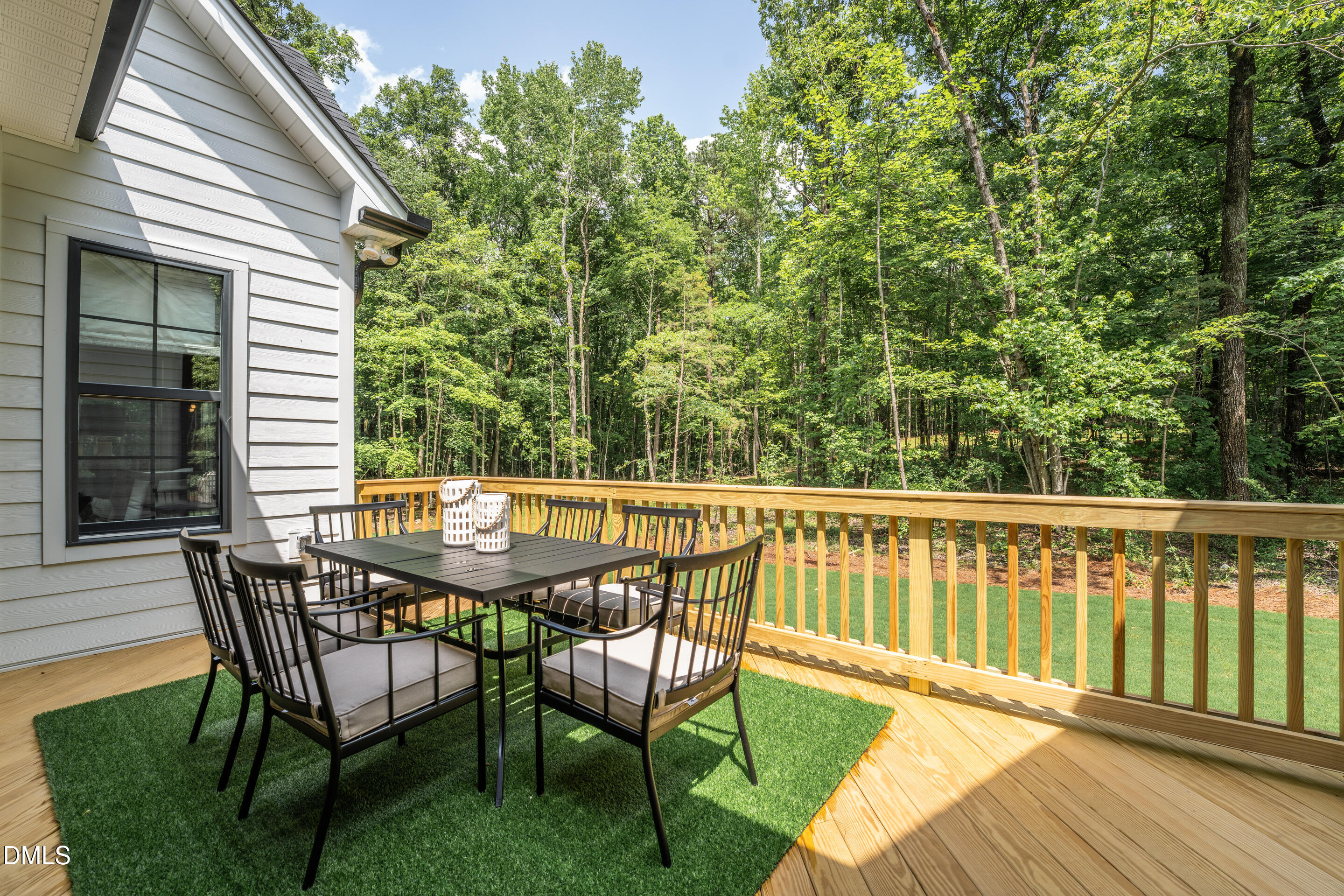 247 Ivy Rdg Road Chapel Hill, NC 27516 - Photo 24 of 70 a view of a chair and table on the wooden deck