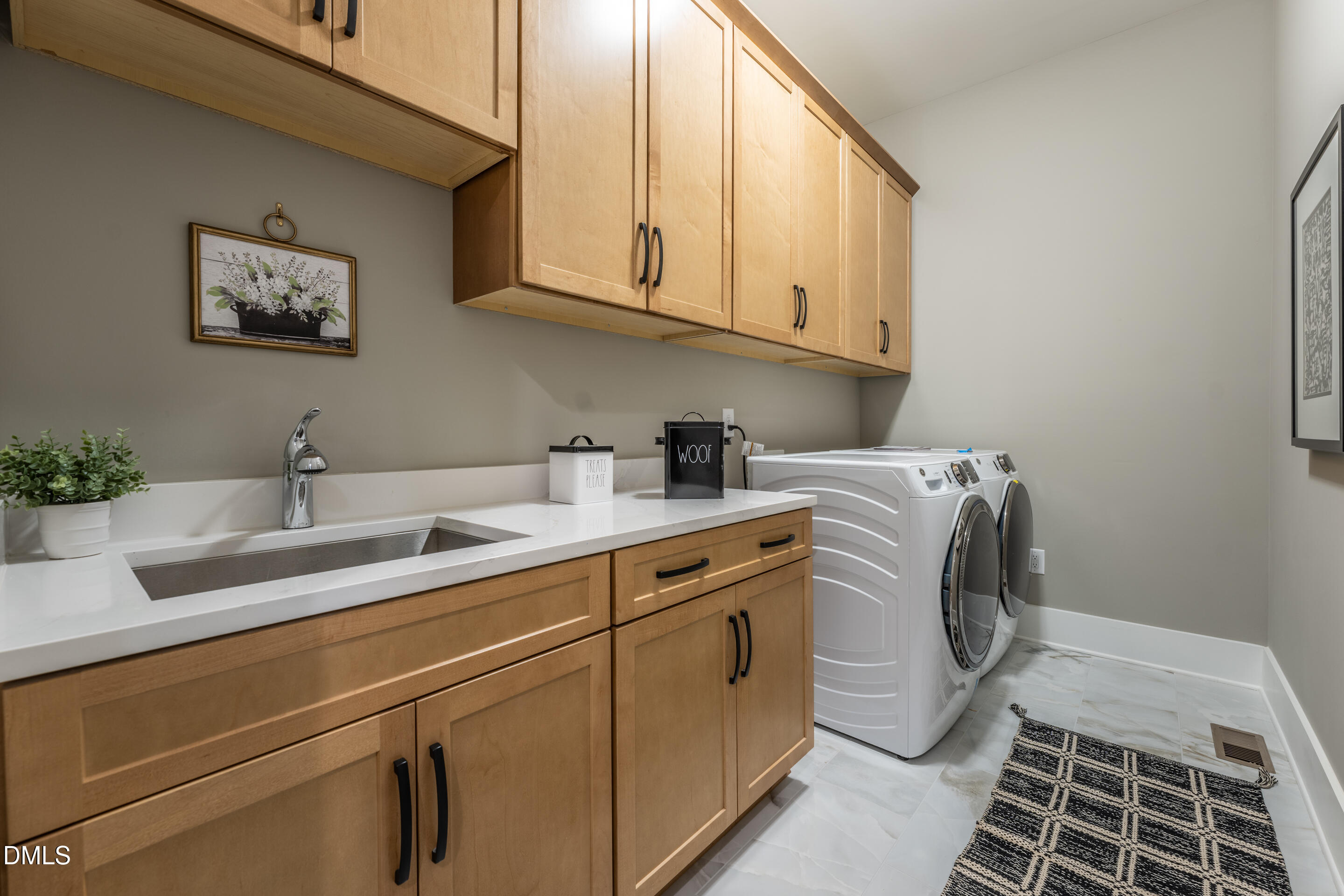 247 Ivy Rdg Road Chapel Hill, NC 27516 - Photo 39 of 70 a utility room with a sink a washer and dryer