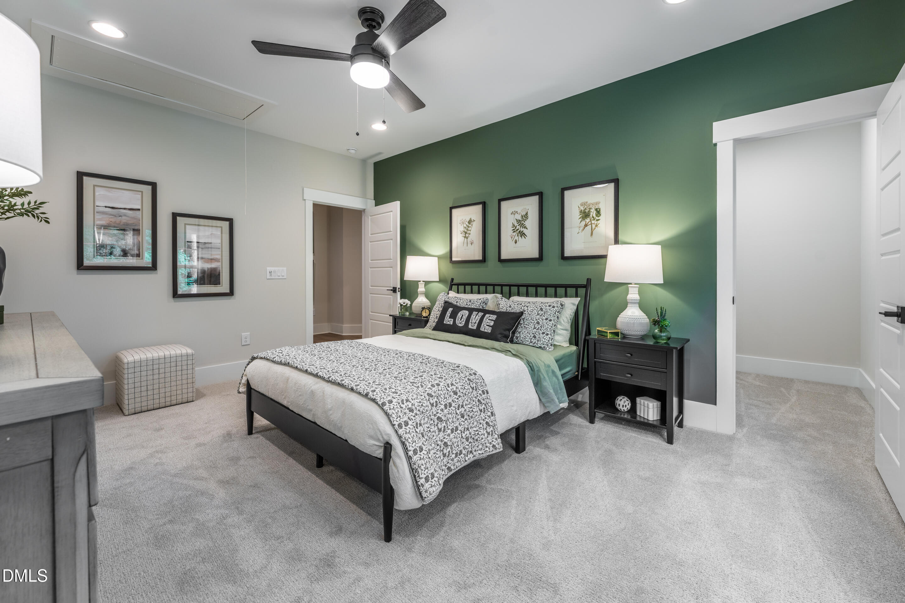 247 Ivy Rdg Road Chapel Hill, NC 27516 - Photo 49 of 70 a spacious bedroom with a bed and a table