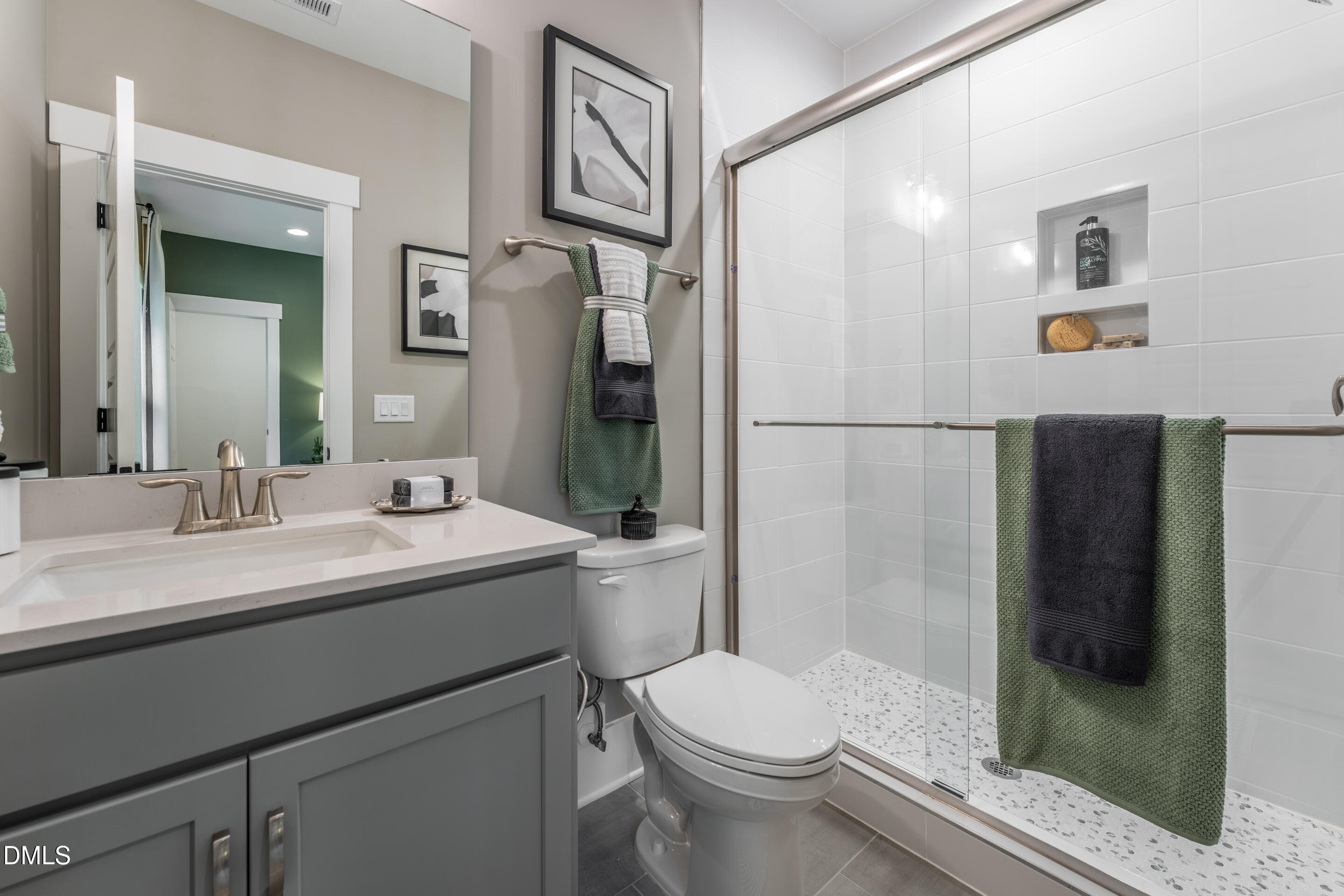 247 Ivy Rdg Road Chapel Hill, NC 27516 - Photo 50 of 70 a bathroom with a sink toilet and shower