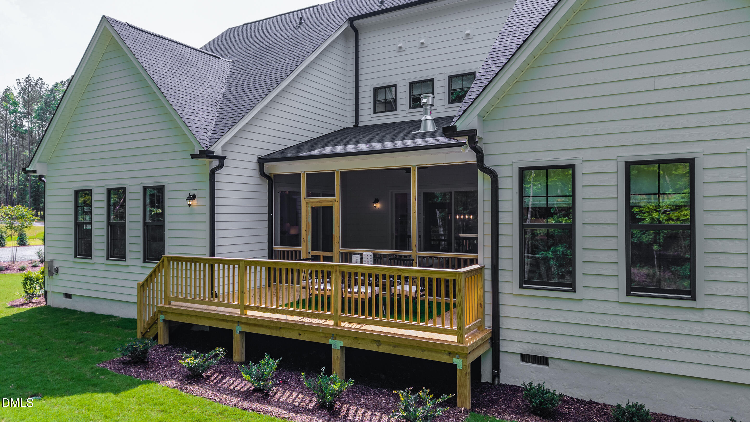 247 Ivy Rdg Road Chapel Hill, NC 27516 - Photo 62 of 70 a view of a chair and tables in the back yard of the house