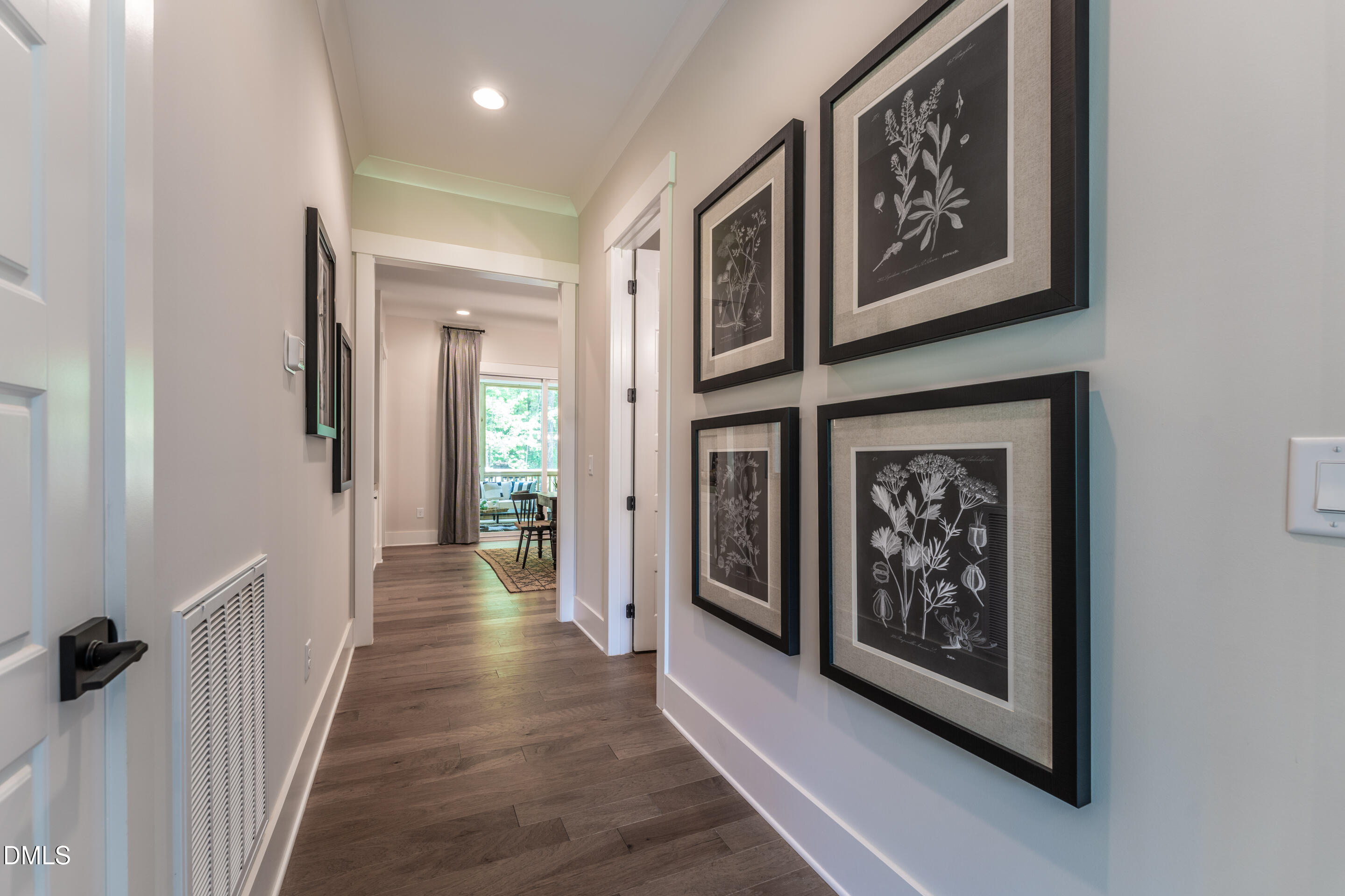 247 Ivy Rdg Road Chapel Hill, NC 27516 - Photo 8 of 70 a view of a hallway with wooden floor and a living room
