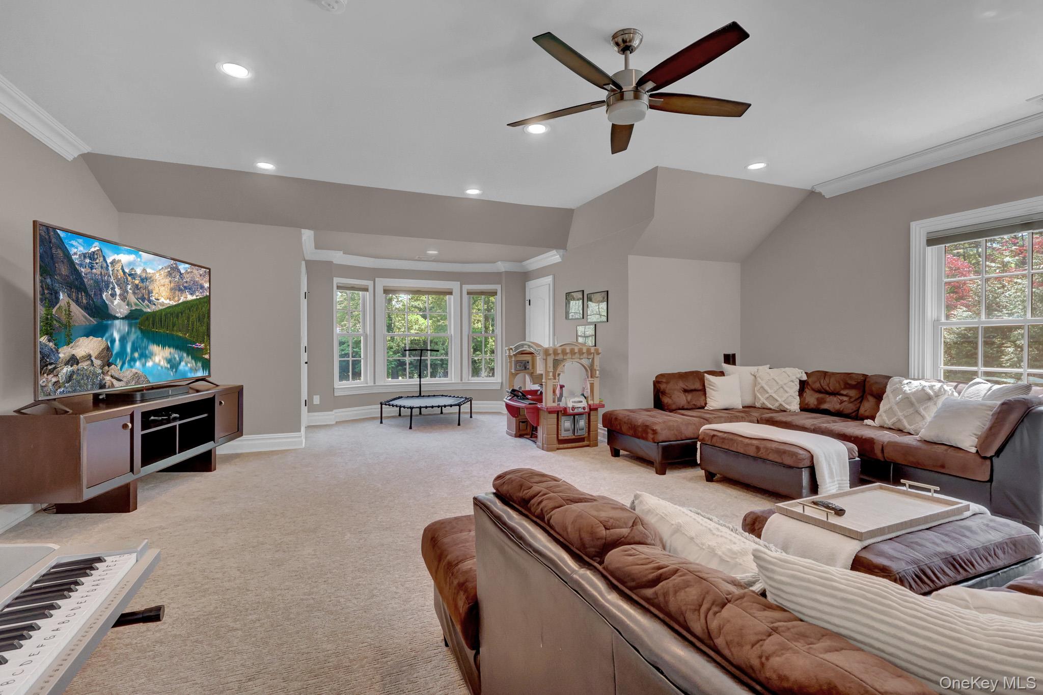 36 Old Field Road Setauket, NY 11733 - Photo 42 of 42 a living room with furniture and a flat screen tv