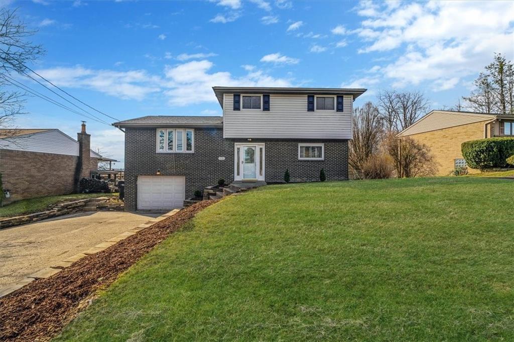 14190 Ridge Road Irwin, PA 15642 - Photo 1 of 49 a front view of house with yard and green space