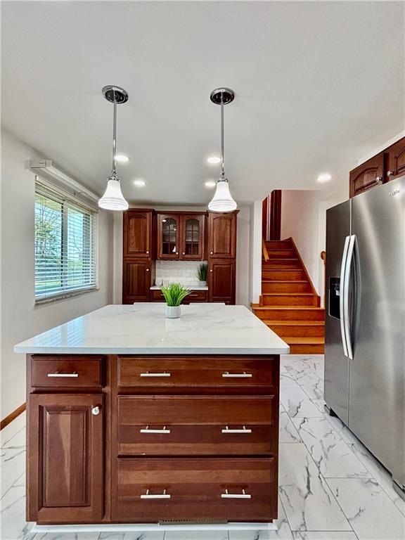 14190 Ridge Road Irwin, PA 15642 - Photo 17 of 49 a kitchen with stainless steel appliances kitchen island granite countertop wooden cabinets and window