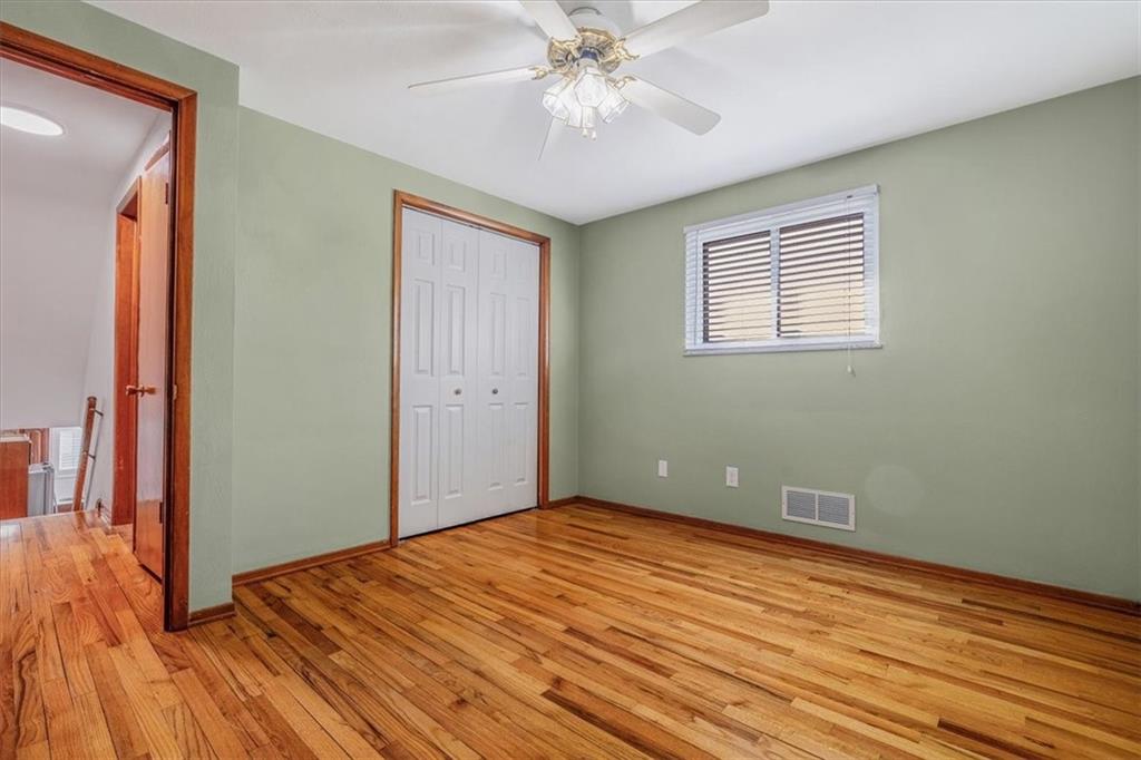 14190 Ridge Road Irwin, PA 15642 - Photo 24 of 49 a view of empty room with wooden floor and fan