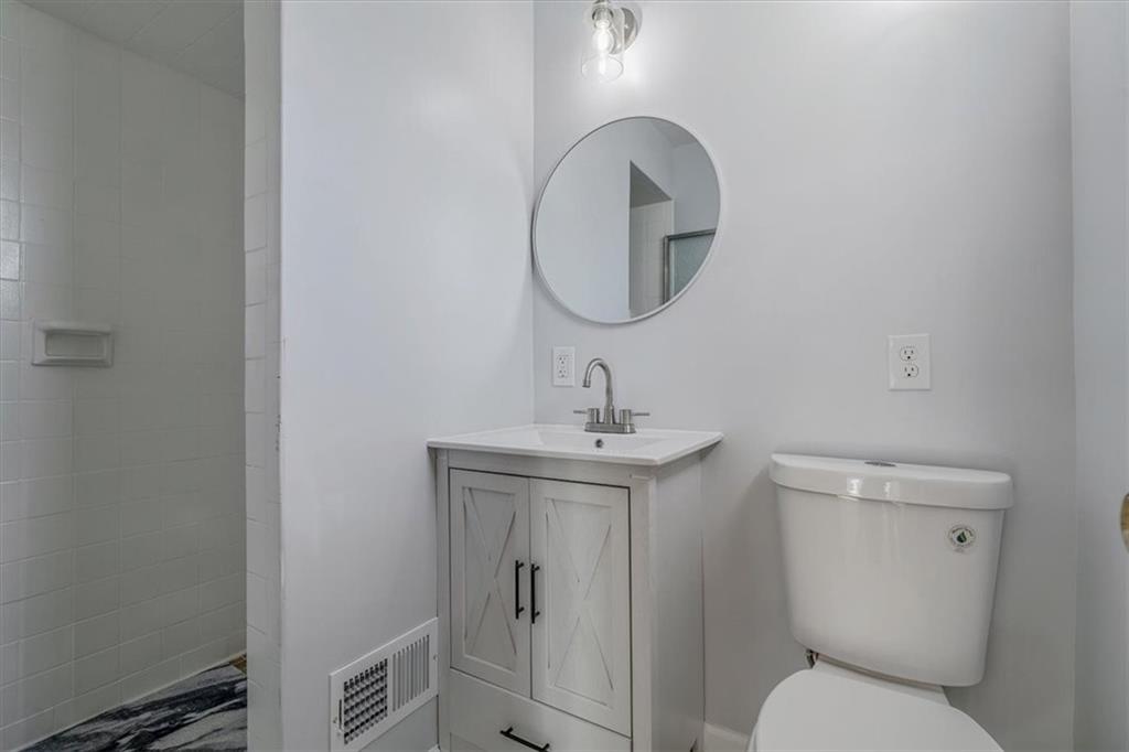 14190 Ridge Road Irwin, PA 15642 - Photo 33 of 49 a bathroom with a toilet a sink and mirror