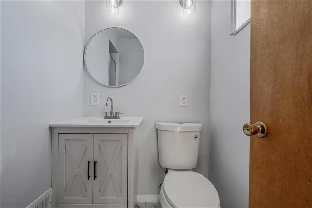 14190 Ridge Road Irwin, PA 15642 - Photo 34 of 49 a bathroom with a toilet a sink and mirror