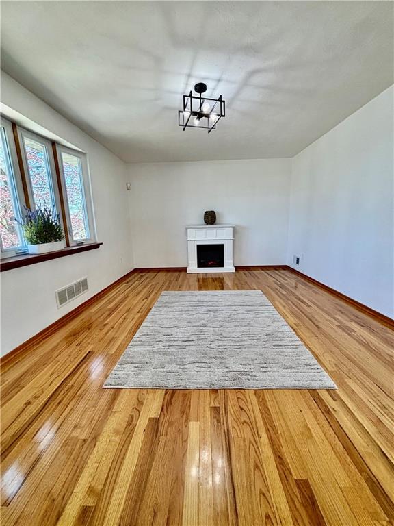 14190 Ridge Road Irwin, PA 15642 - Photo 7 of 49 a view of empty room with window and wooden floor