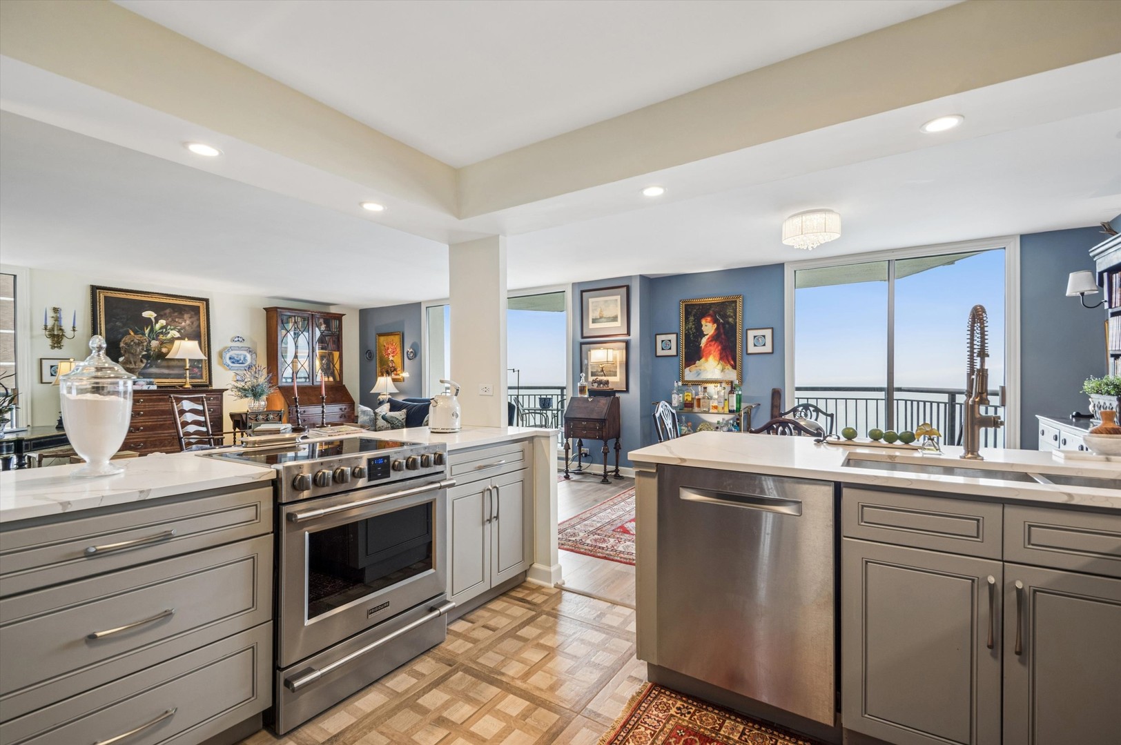 6007 North Sheridan Road, Unit 15B Chicago, IL 60660 - Photo 2 of 18 a kitchen with a stove top oven sink and cabinets