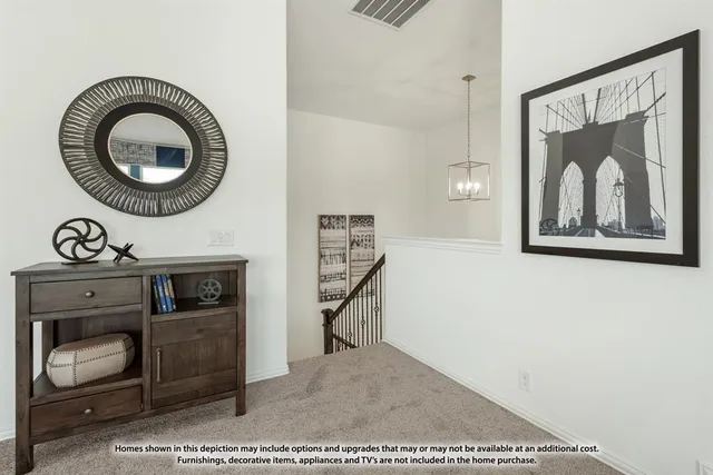 a living room with furniture a flat screen tv and a toilet