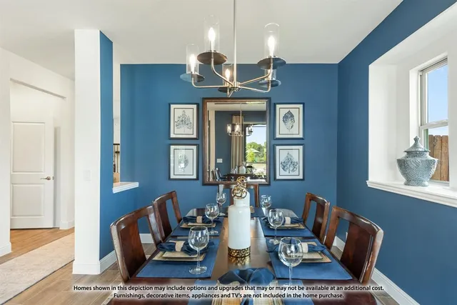 a dining room with table and wooden floor
