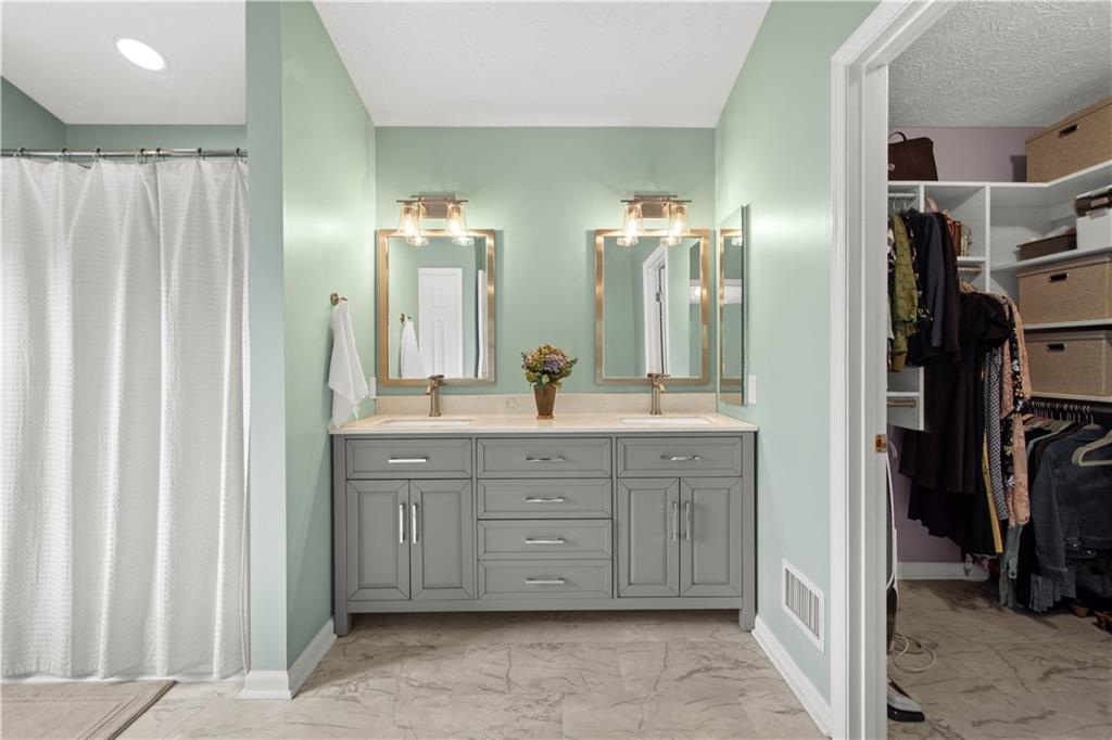 602 Birch Court Bridgeville, PA 15017 - Photo 27 of 47 a spacious bathroom with a double vanity sink and a mirror