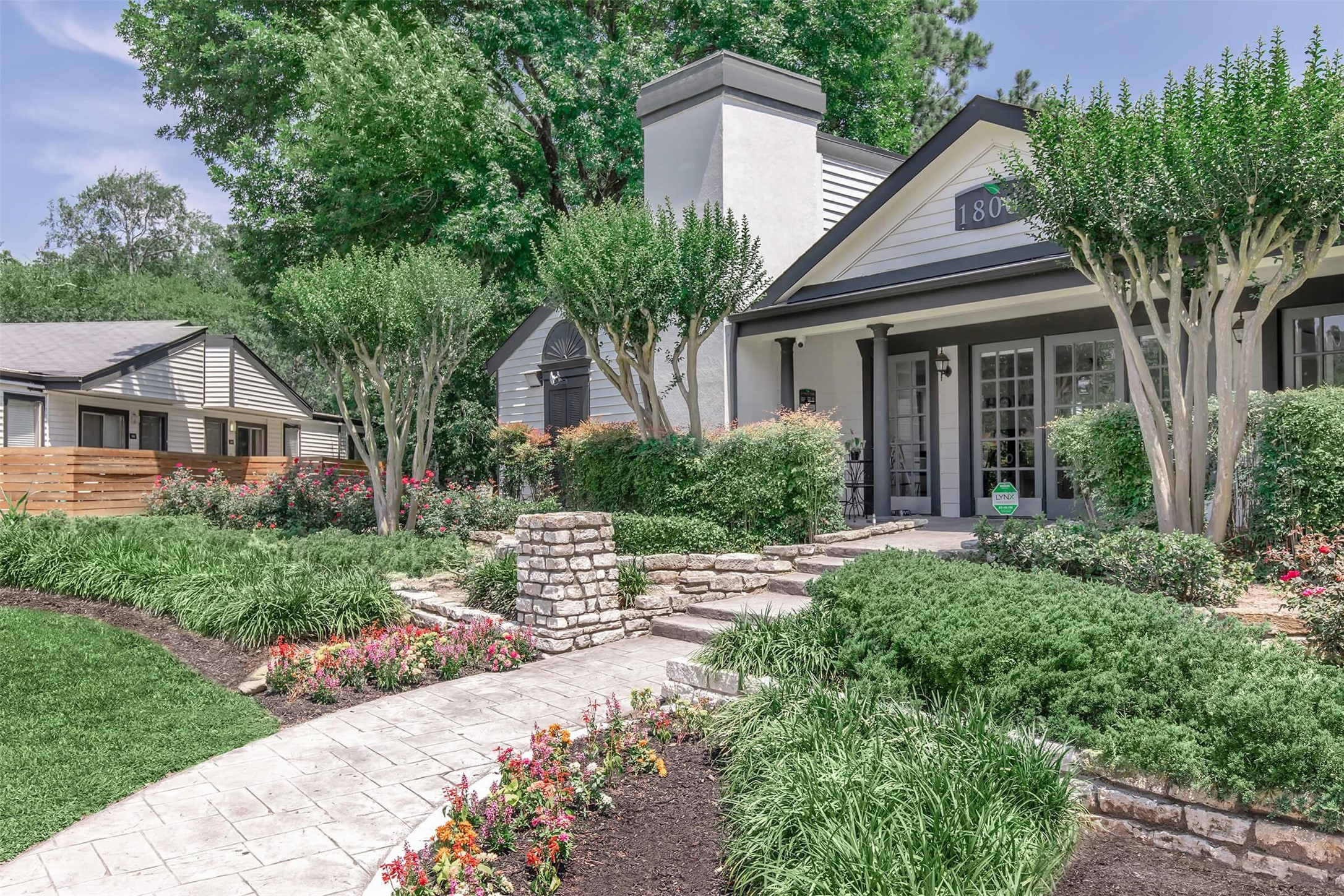 18001 Cypress Trace Road, Unit 1106 Houston, TX 77090 - Photo 22 of 32 a front view of house with yard and green space